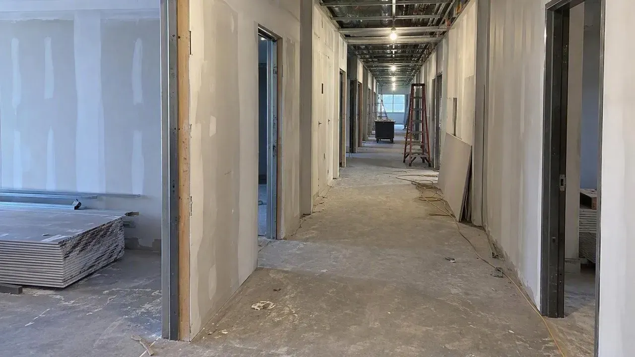 Commercial corridor walls being boarded with fire-rated Type X drywall