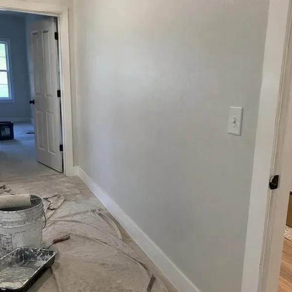 Wall repainted after several drywall hole repairs