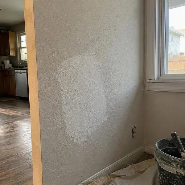 Knockdown texture patch matched on a wall before paint