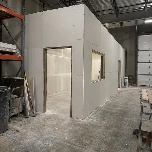 Warehouse office enclosure with freshly installed commercial drywall